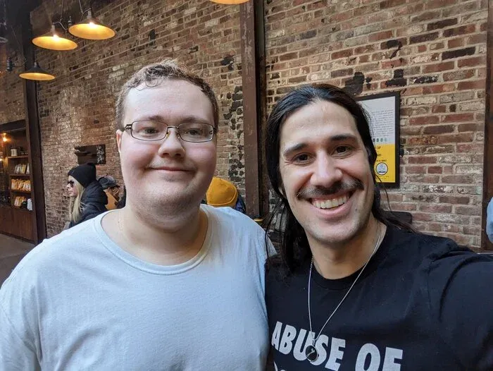 Pablo and Andrew meet for coffee before a doomed bridge-crossing attempt